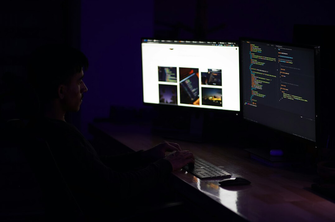 hands typing code on keyboard